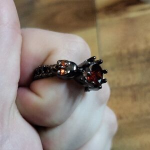 Elegant Black and Red Skull Ring